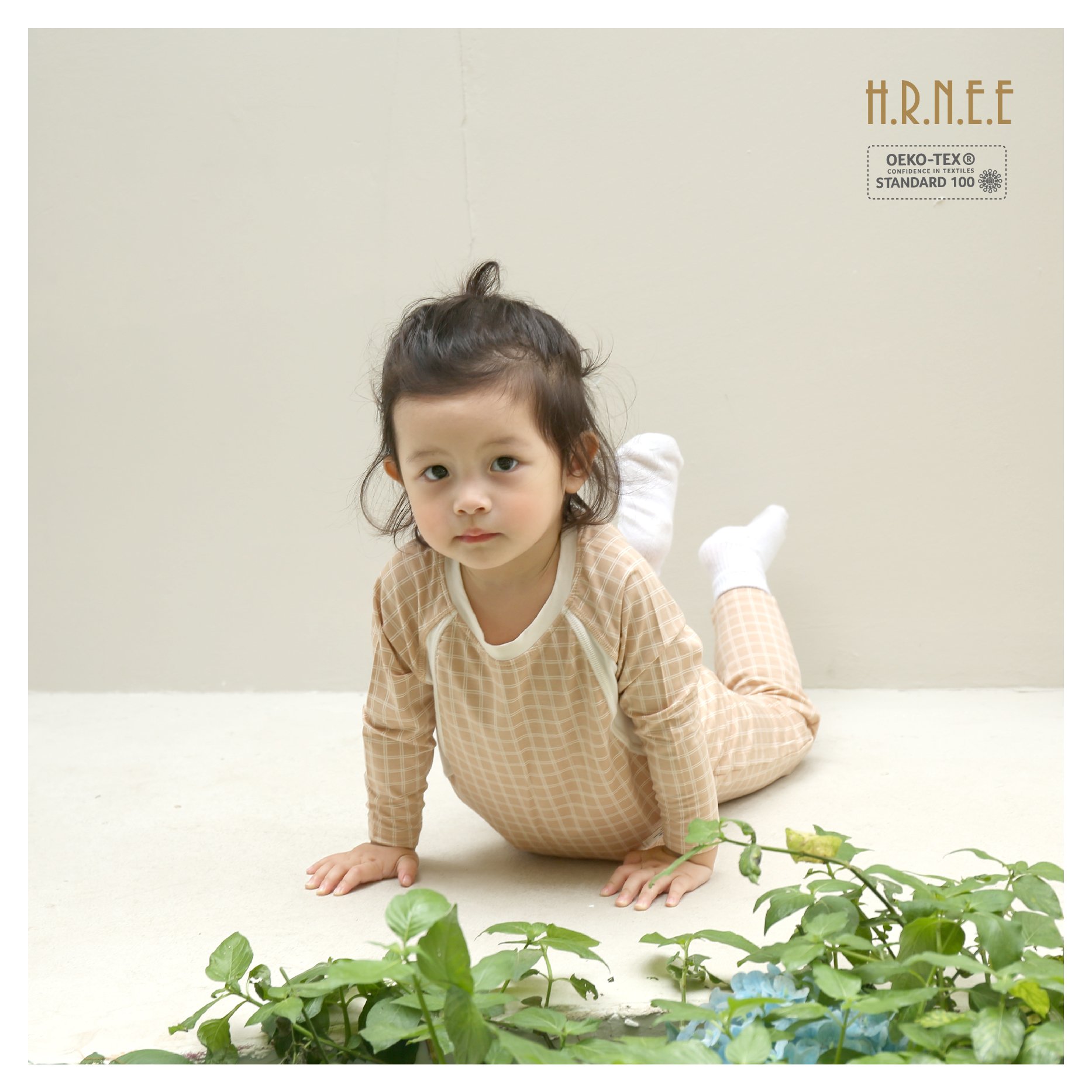 z5700396064596_8ec93046c88c47b94275b35b5a06a9f5 kid wearing a beige stripe set which include 1 long t-shirt with 1 long pair of pants