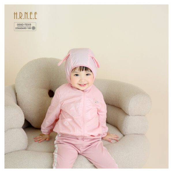 a baby girl wearing windbreaker jacket